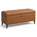 Banc coffre de rangement avec assise rembourrée, aspect cuir cognac et pieds en bois marron foncé, 110 x 40 x 48 cm